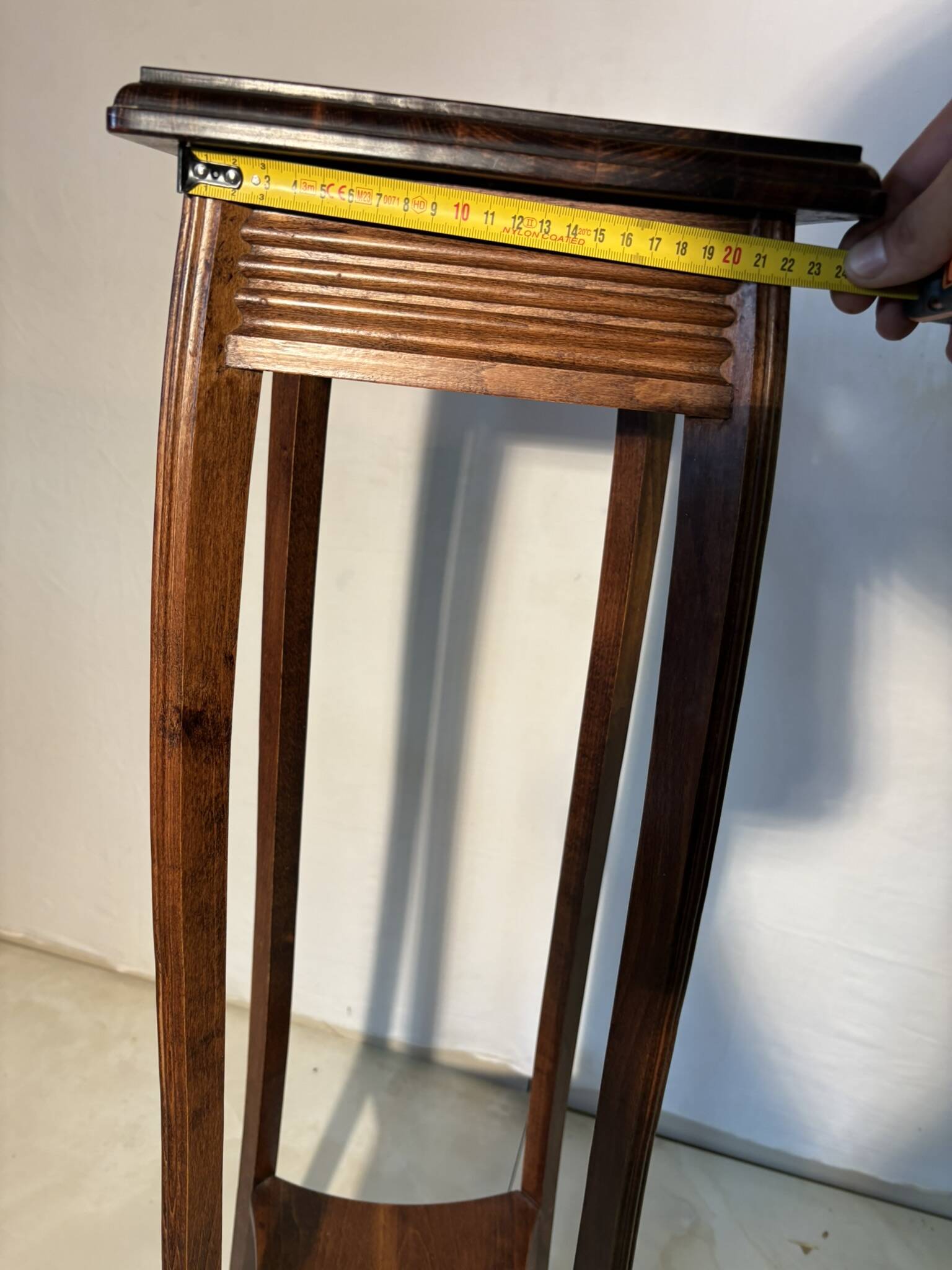 Vintage dark wood side table with curved base