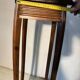 Vintage dark wood side table with curved base