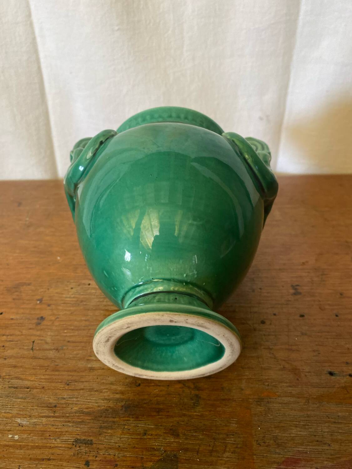 Antique green ceramic vase with handles