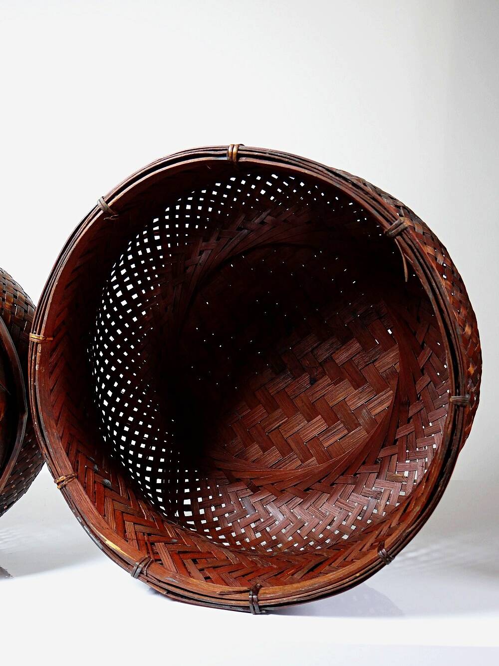 Pair of vintage nesting handmade Japanese woven bamboo baskets