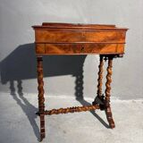 Antique wooden sewing table with drawer.