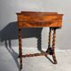 Antique wooden sewing table with drawer.