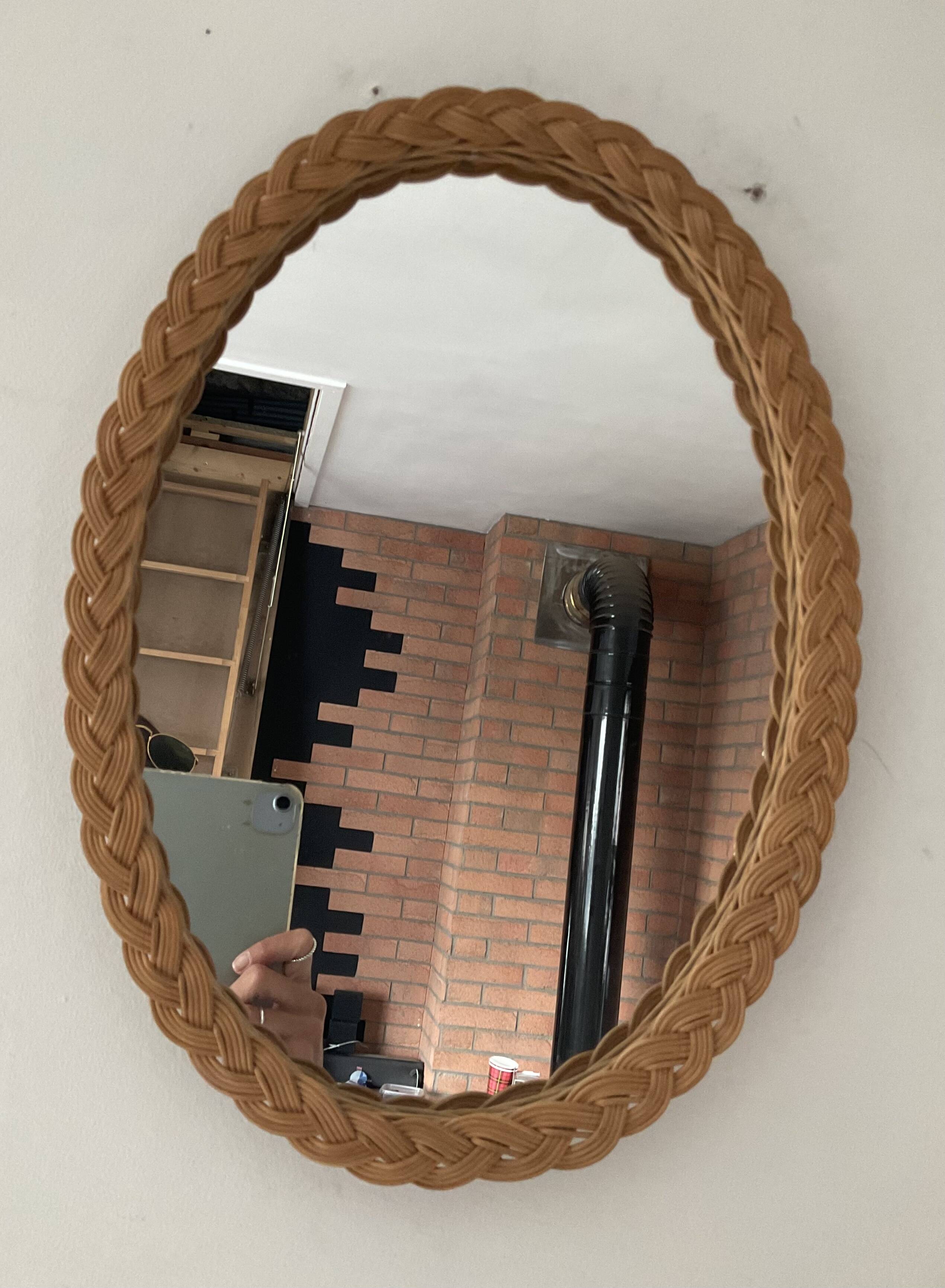 Vintage oval rattan mirror