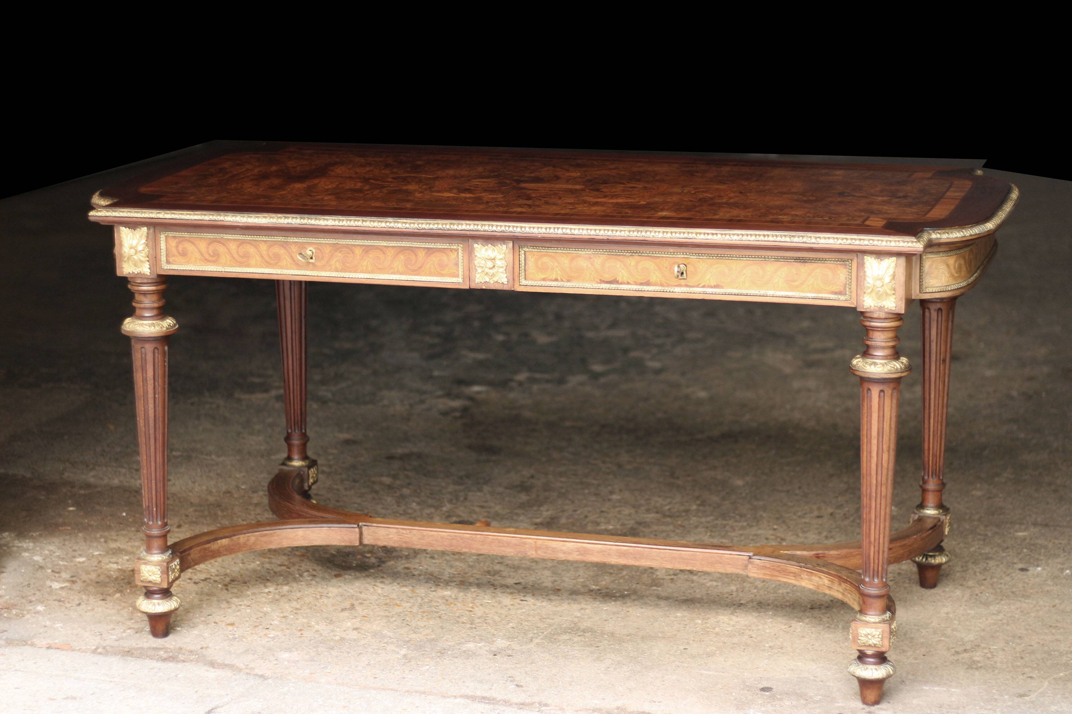 Superb Napoleon III table. Marquetry top and gilded bronzes.
