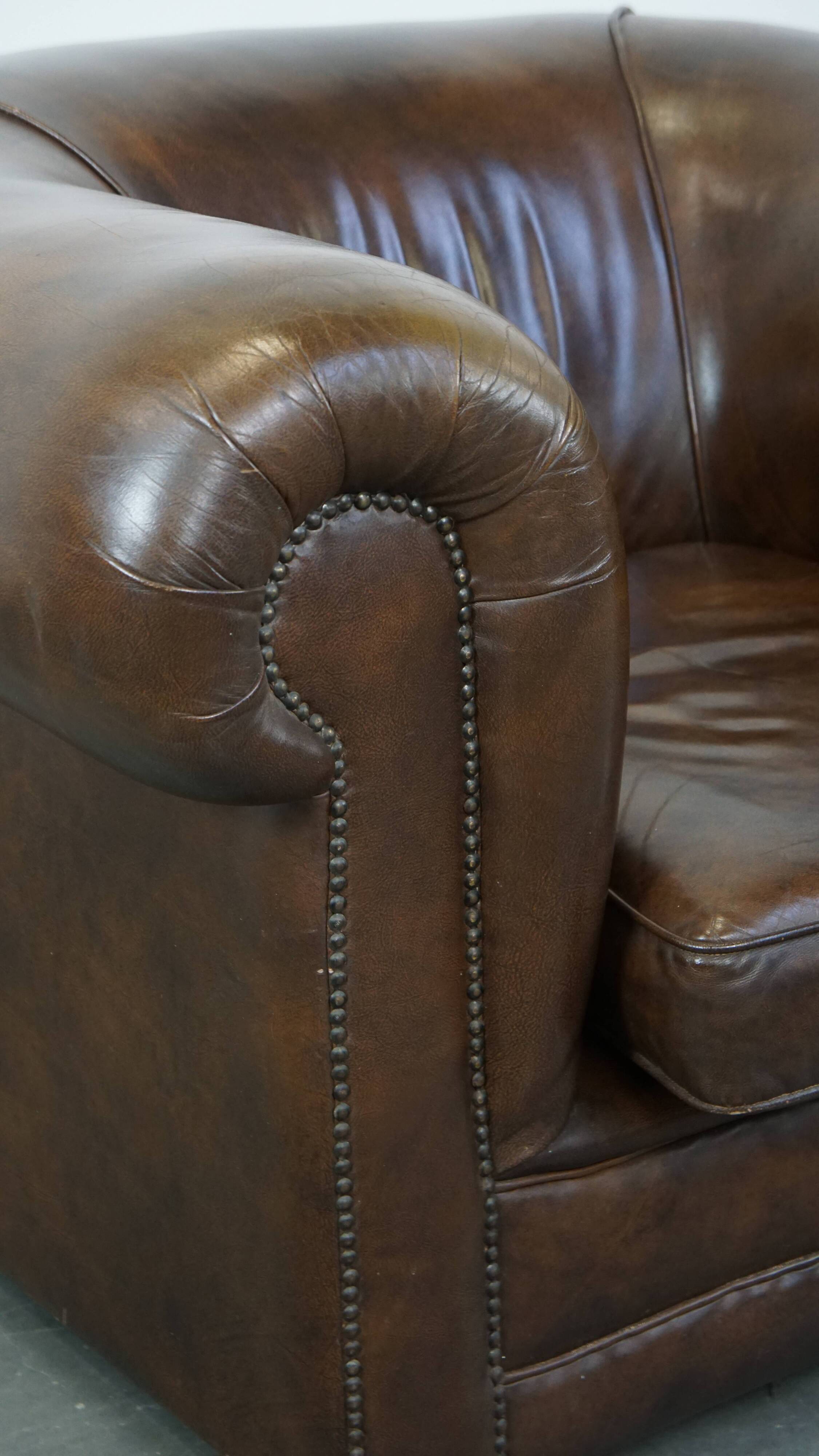 2 Chesterfield armchairs in dark brown cowhide