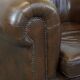2 Chesterfield armchairs in dark brown cowhide