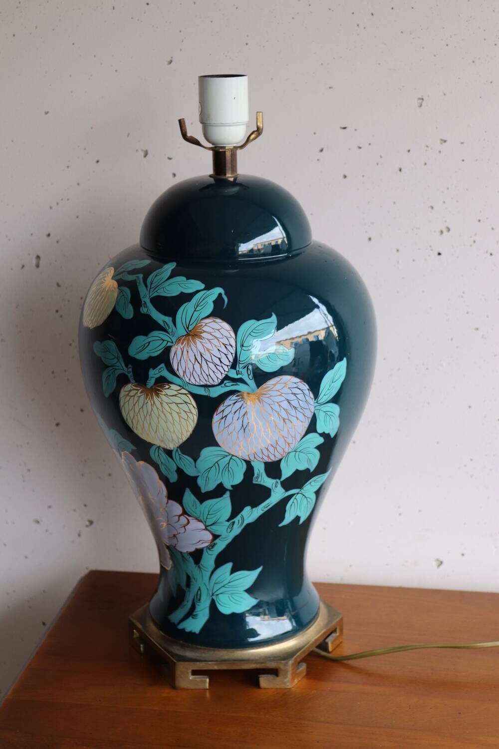 Vintage ceramic lamp with floral decoration.