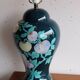 Vintage ceramic lamp with floral decoration.