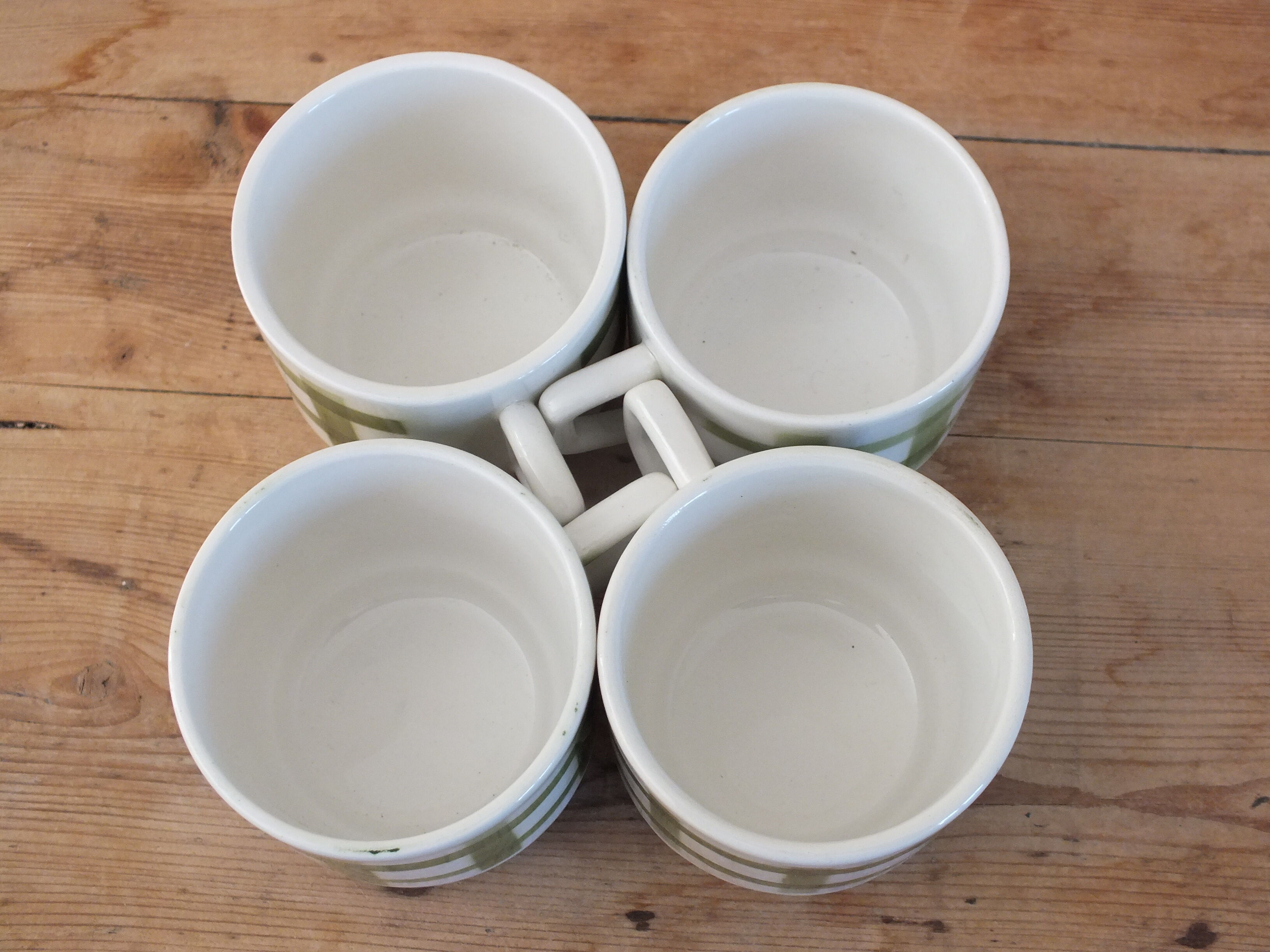4 vintage cups with green tile decor