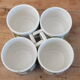4 vintage cups with green tile decor