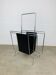 Chrome and black leather magazine rack, 1970s.