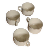 A set of 4 Sarreguemines ecru and gold earthenware cups