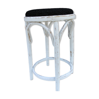 Old curved wooden stool revisited patinated white