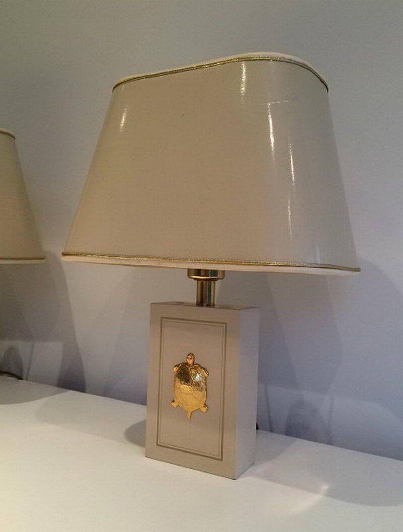 Pair of lamps decorated with golden turtles