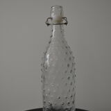 Clear bottle with pegs