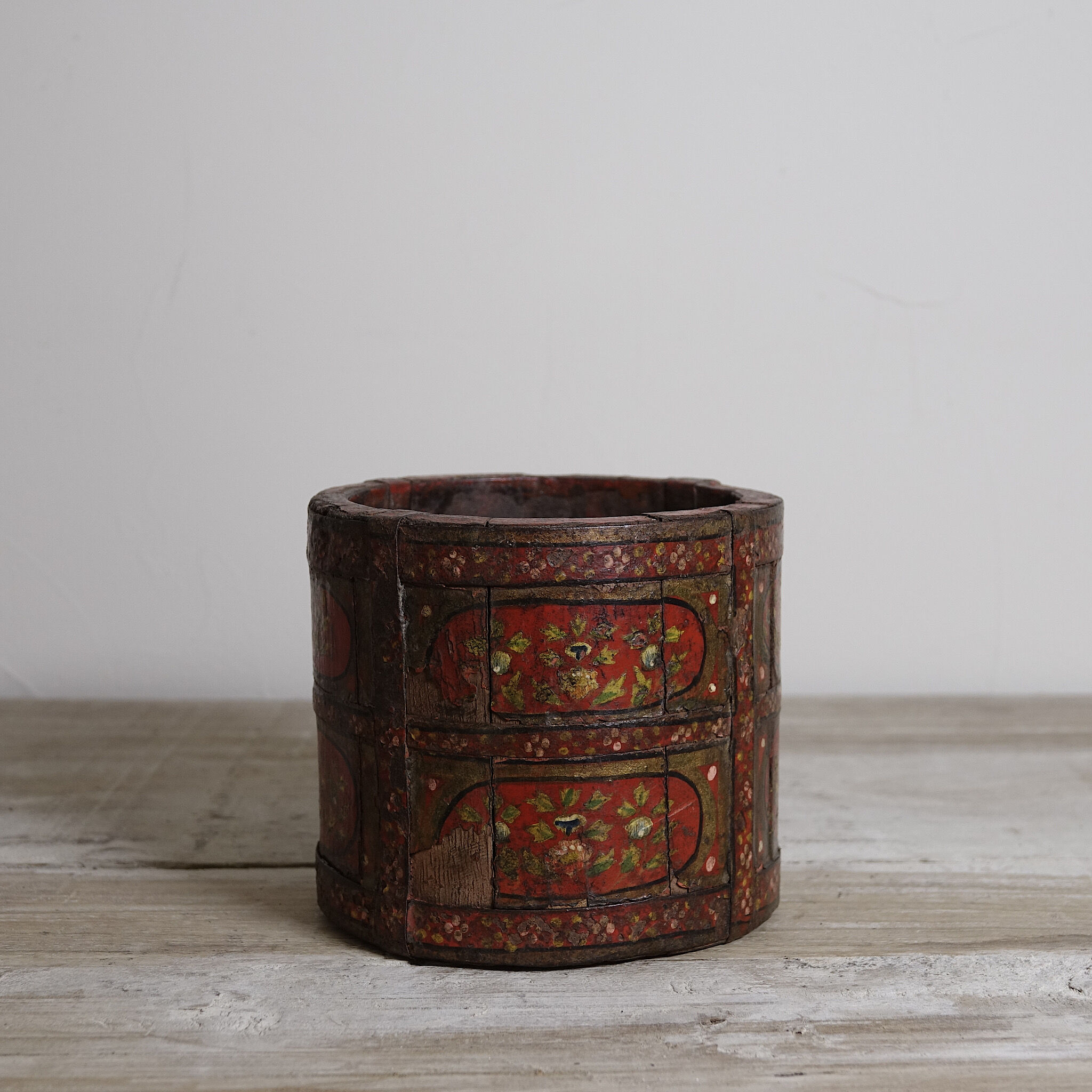 Antique wooden pot painted by hand