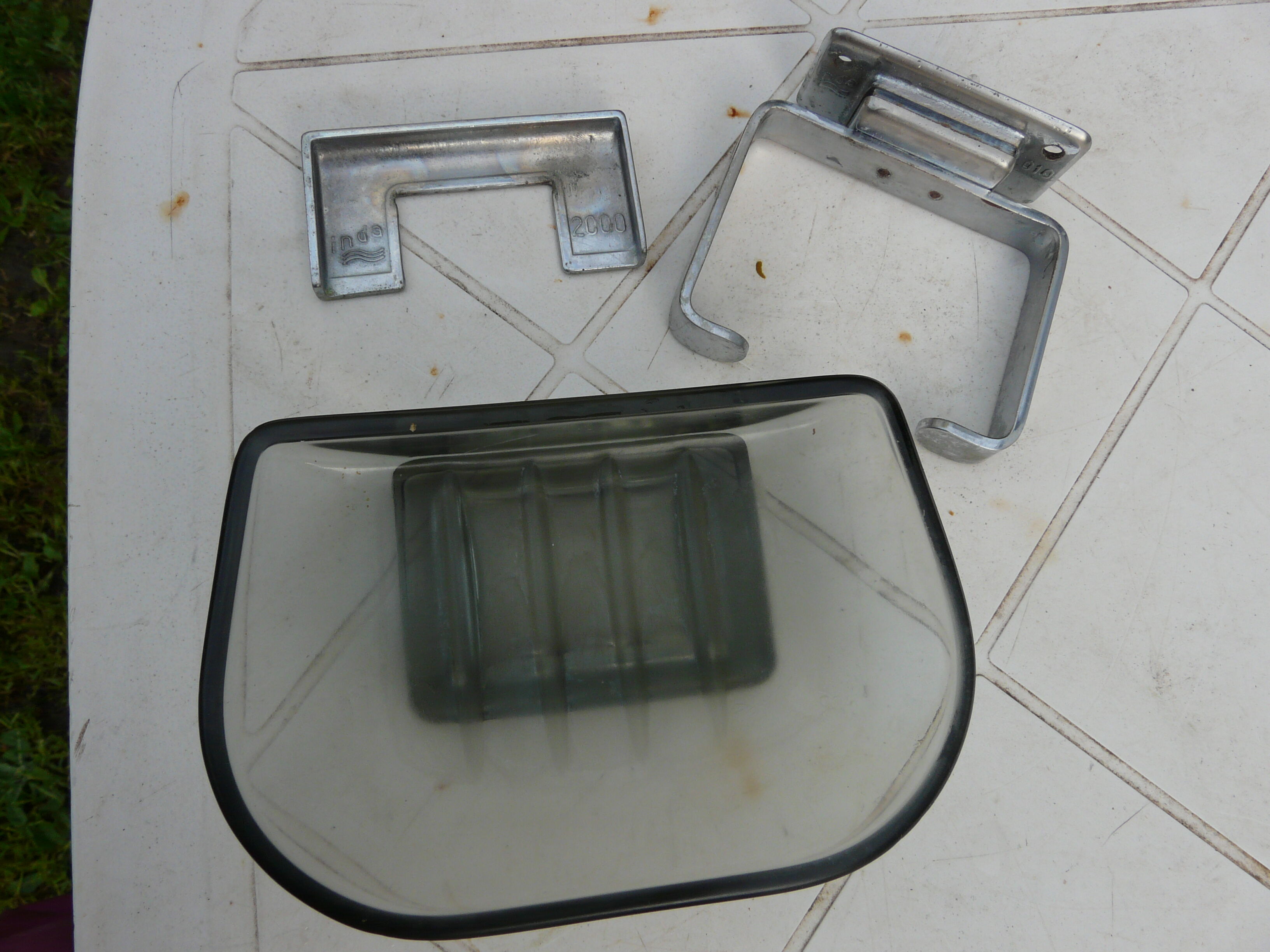 Chrome metal soap holder and smoked glass bathroom accessory