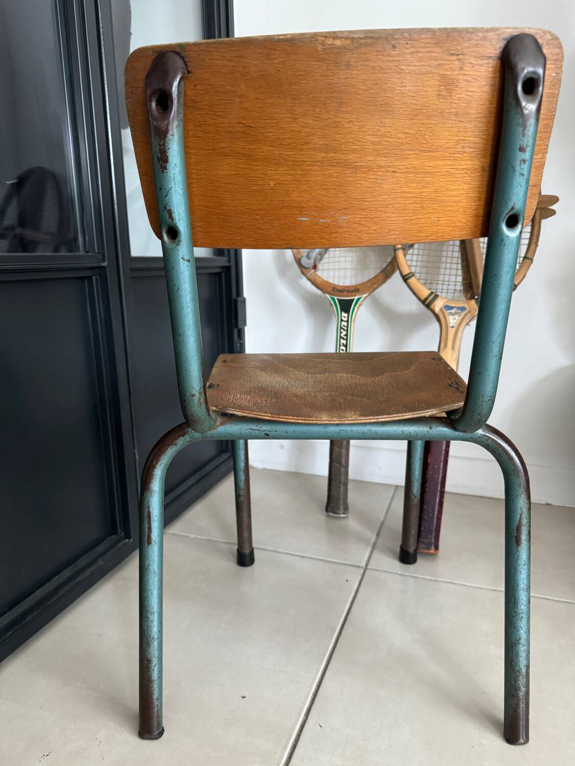 Old wooden and metal children's school chair