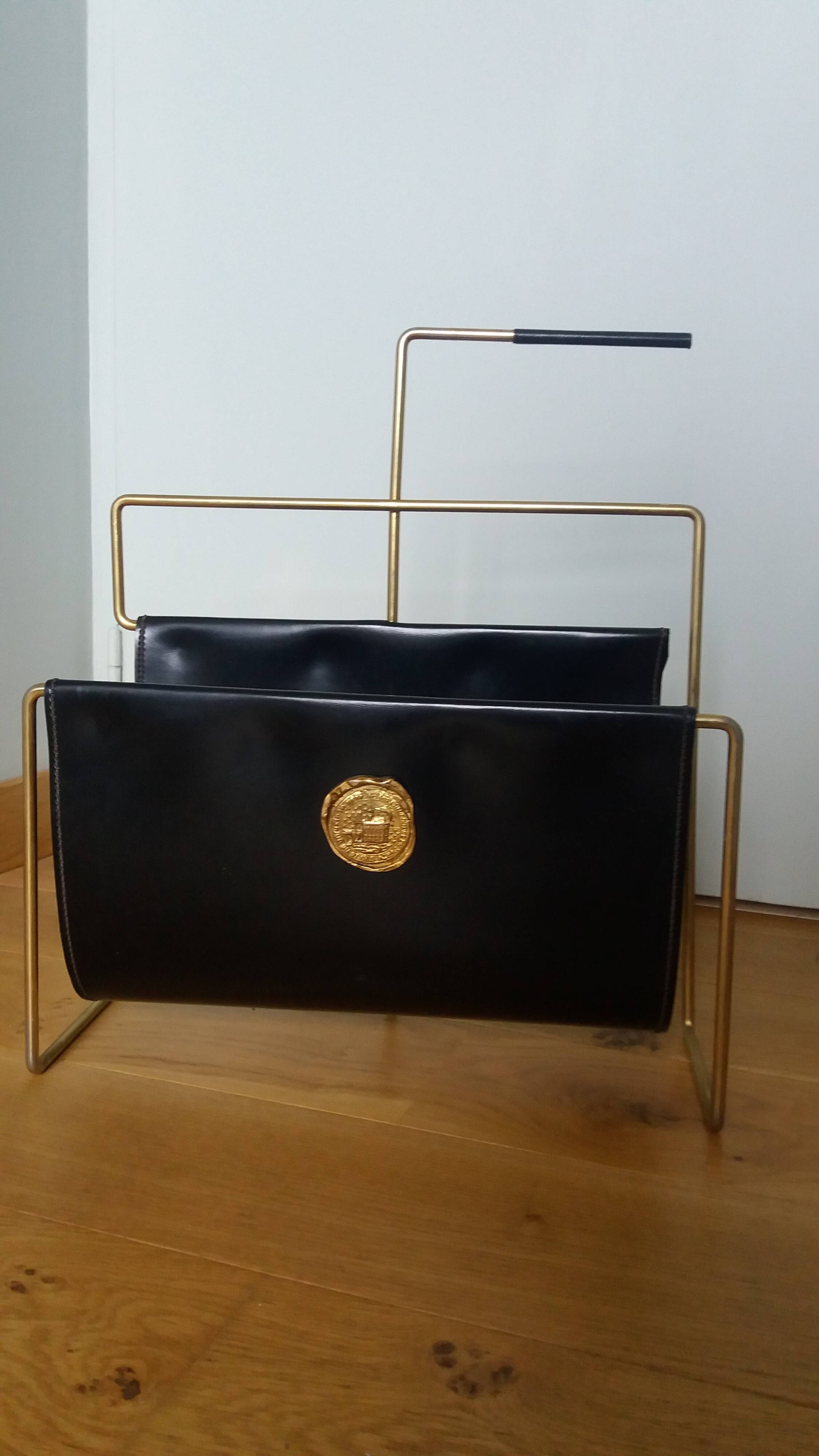 Modernist magazine rack in the style of Jacques Adnet