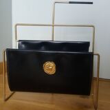 Modernist magazine rack in the style of Jacques Adnet