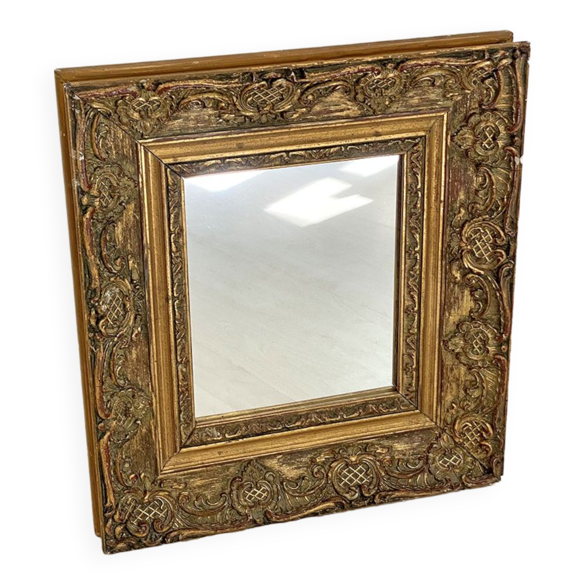 Small old mirror in gilded wood