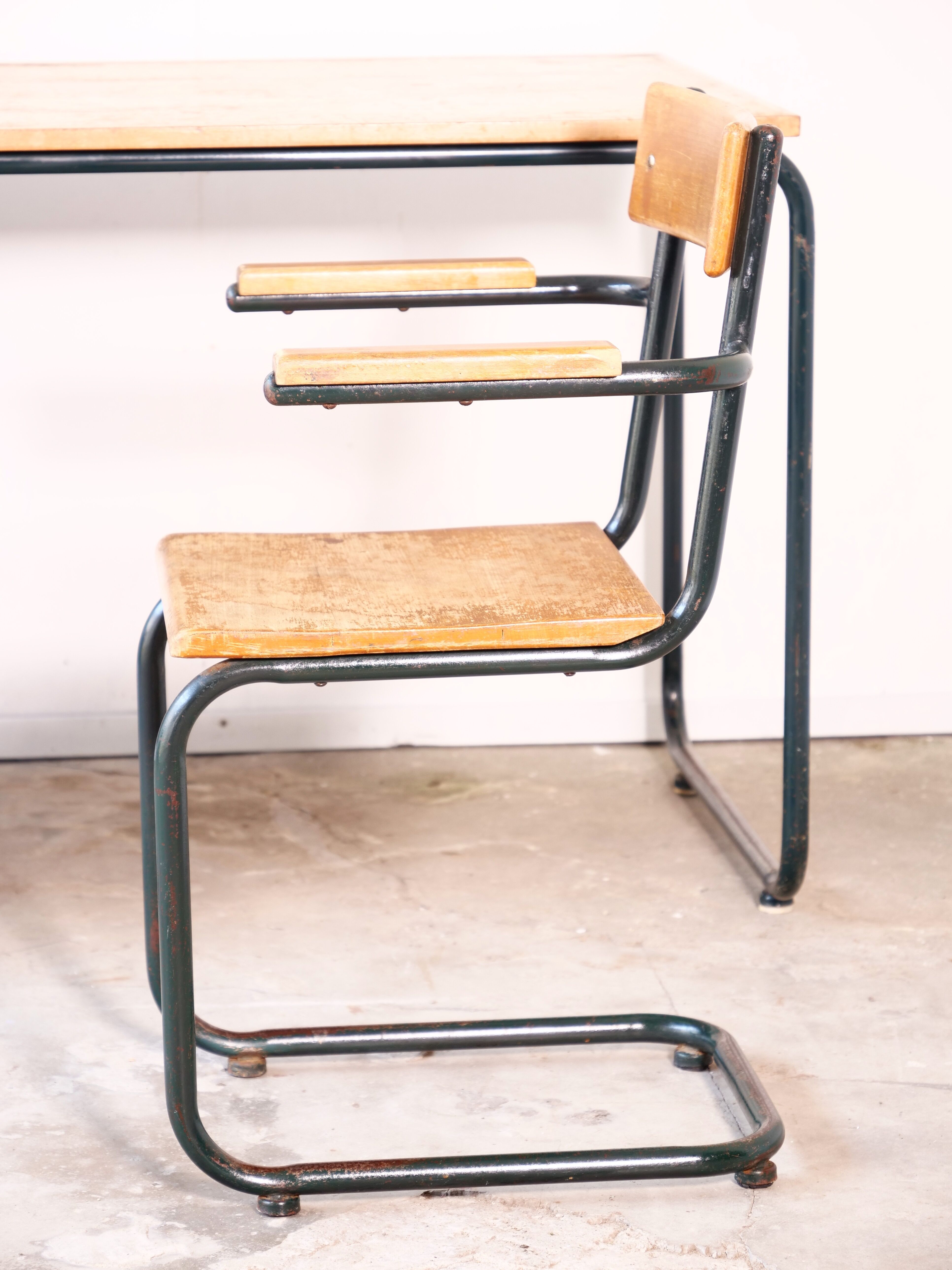 Desk with bauhaus style tubular steel chair