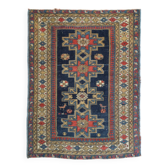 Antique tissé à la main - Tapis persan à fond bleu avec des figures ressemblant à des oiseaux