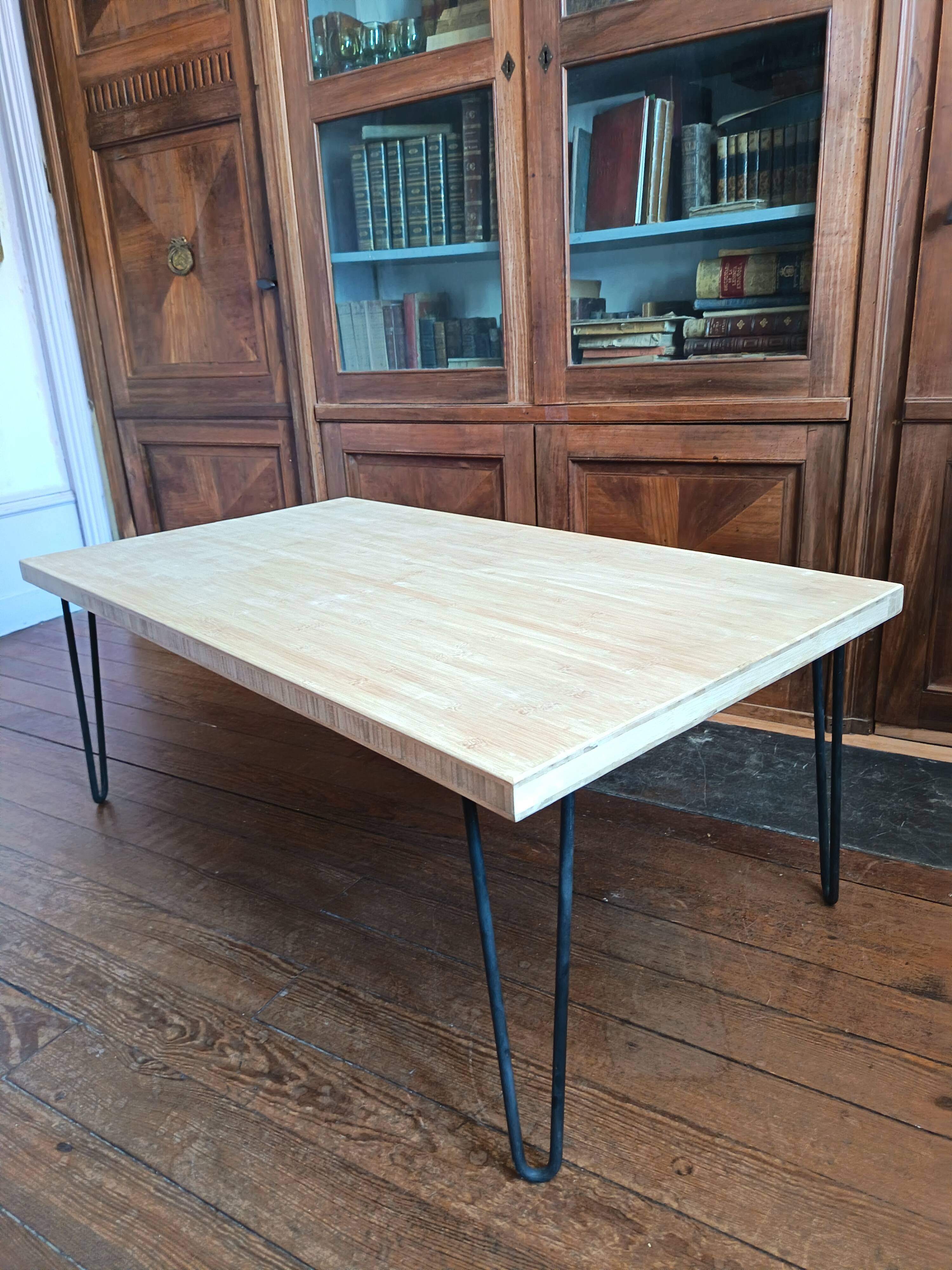 Coffee table in solid bamboo with steel legs.