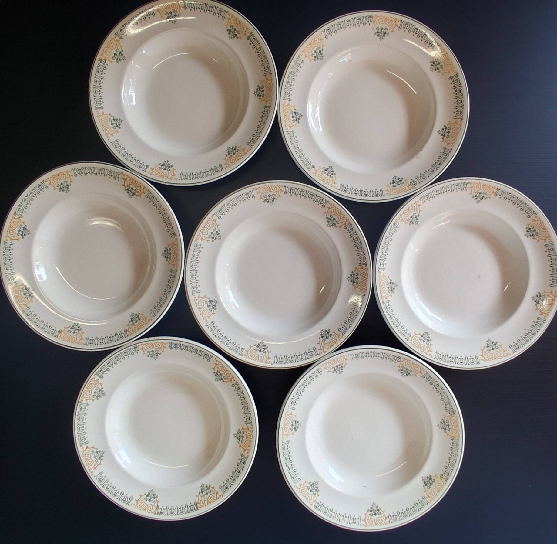 Set of 7 antique deep plates from Longwy, "Savigny" model, in good condition.