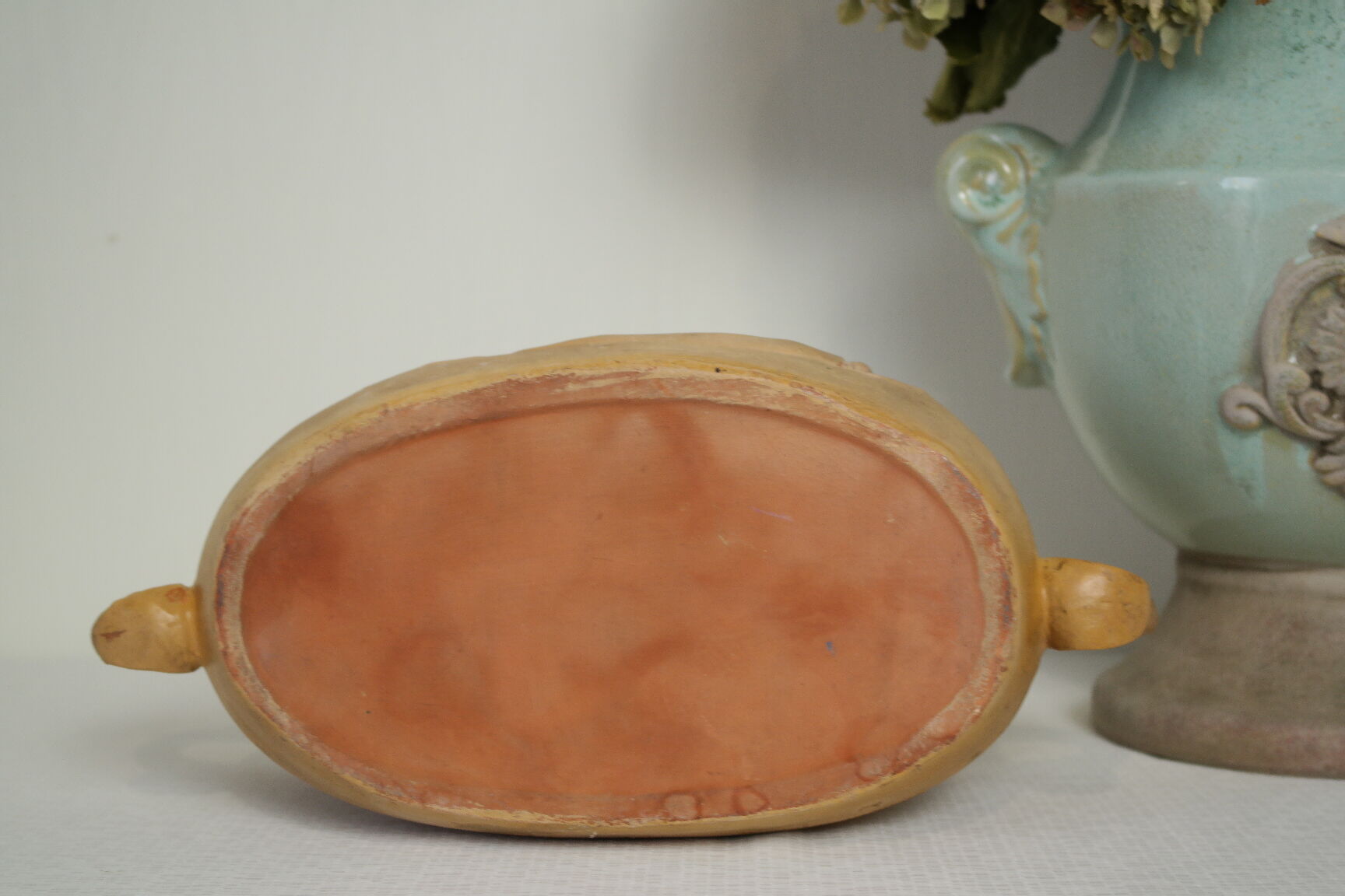 Art Nouveau jardinière with bas-reliefs in terracotta.