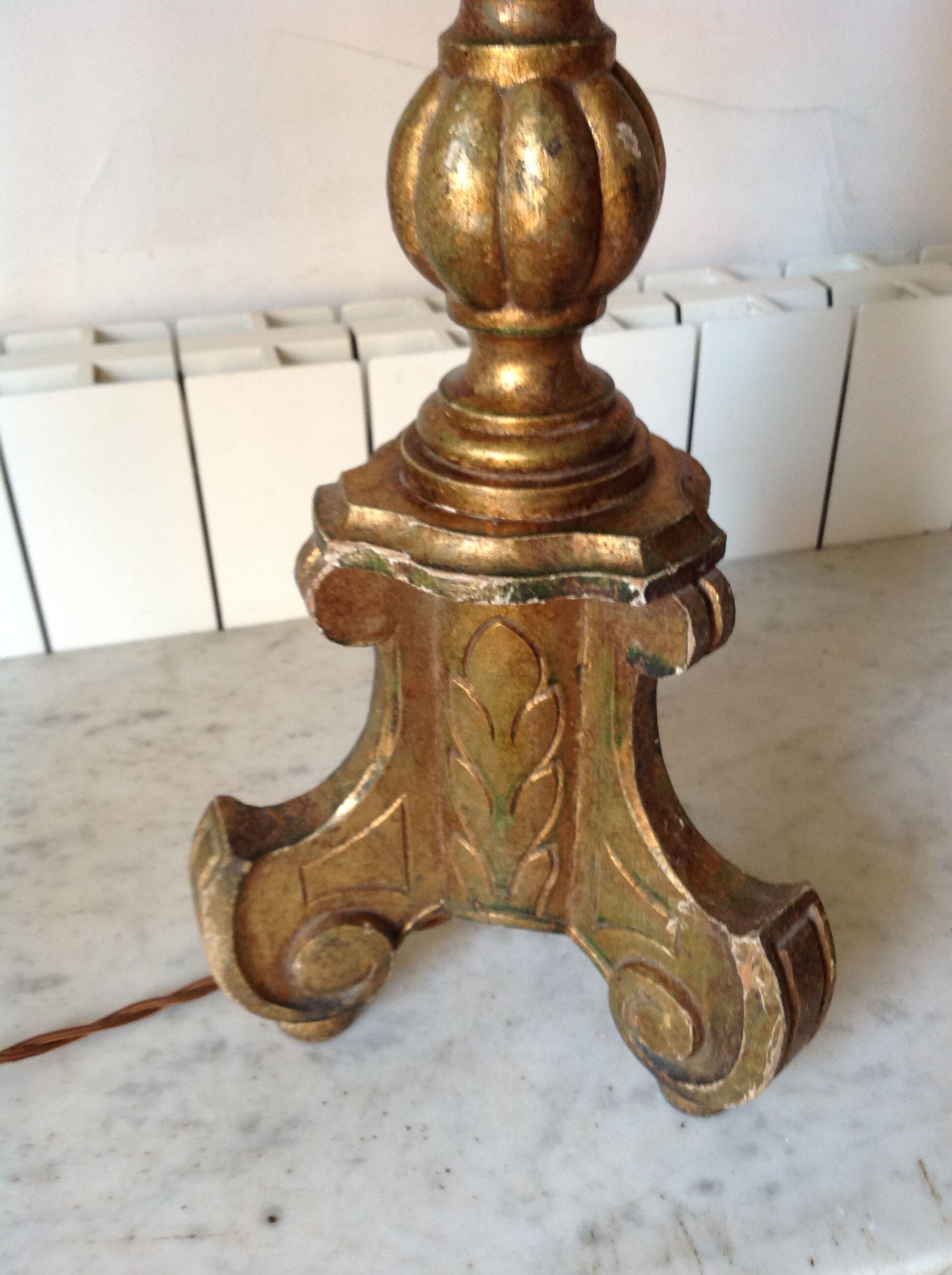 Old chandelier in gilded wood