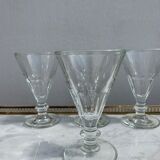 4 glasses of moulded pressed glass wine on foot