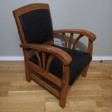 Colonial armchair in teak and black leather