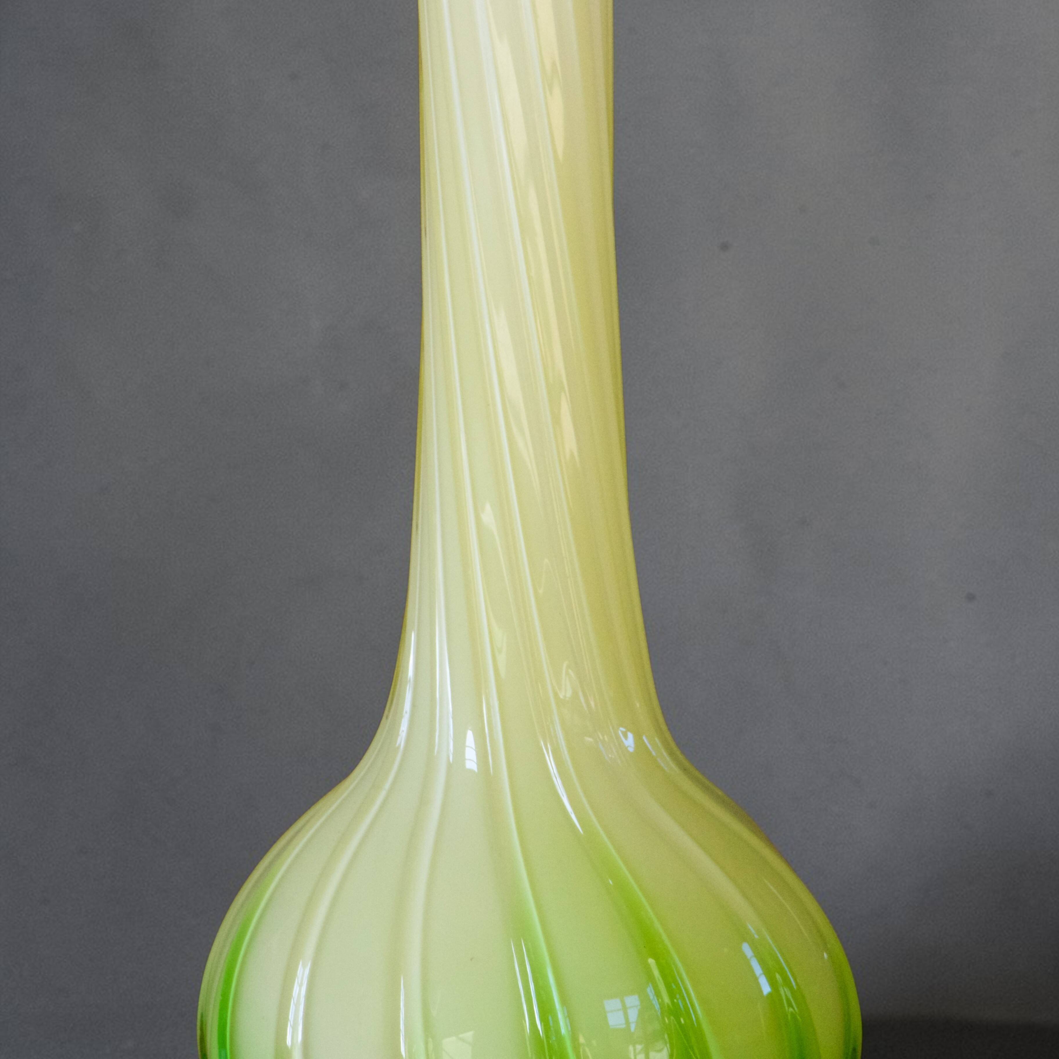 Blown glass vase from Murano in the shape of a yellow flower.
