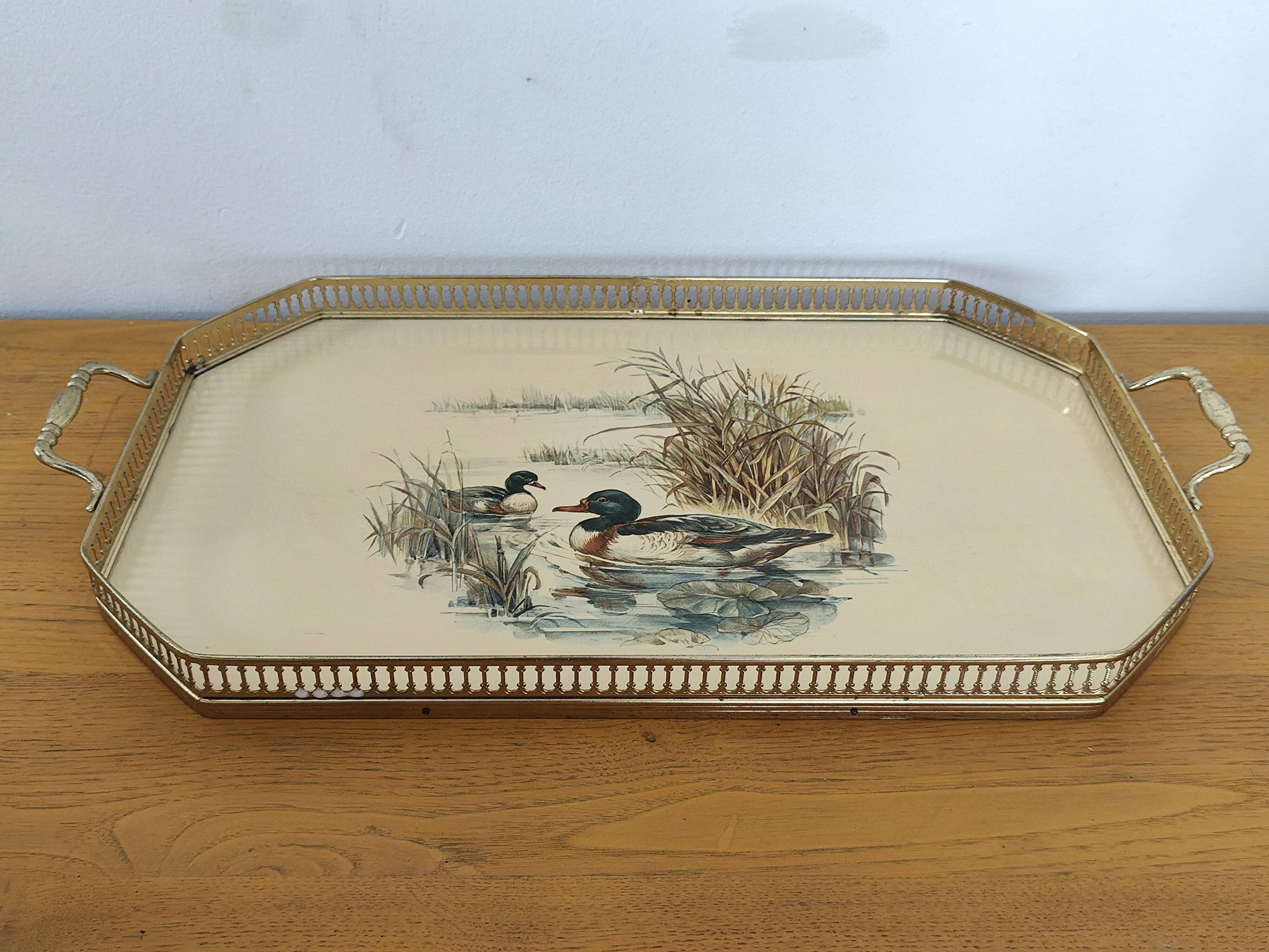 Vintage service tray with a golden gallery and mirror, decorated with ducks.