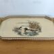 Vintage service tray with a golden gallery and mirror, decorated with ducks.