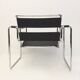 Fauteuil tubulaire et cuir noir