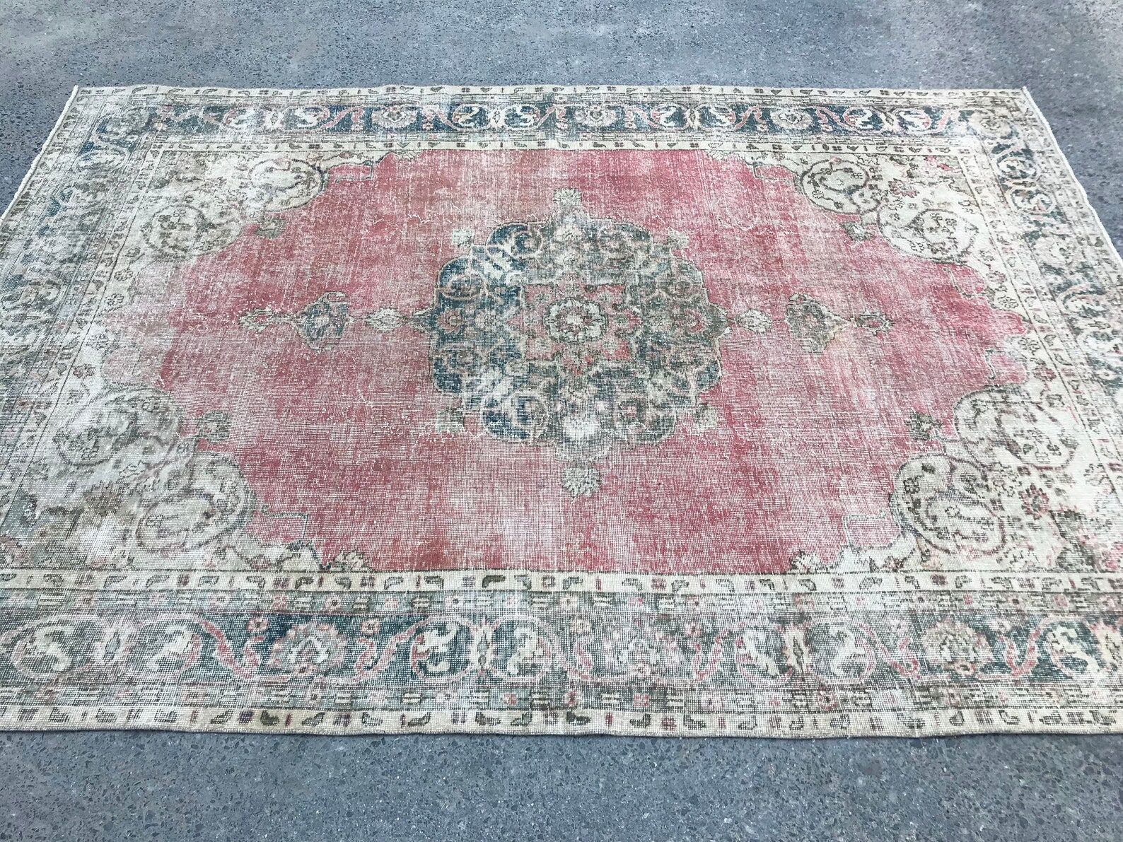 Pale pink rug with medallion