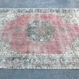 Pale pink rug with medallion