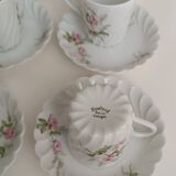 Haviland Limoges porcelain 10 coffee cups and 9 saucers with floral decoration.