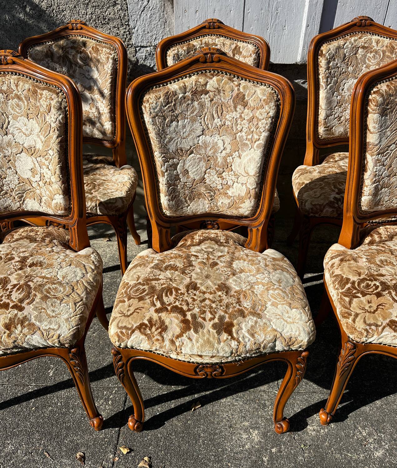 8 cherry wood chairs in Louis XV style with velvet upholstery.