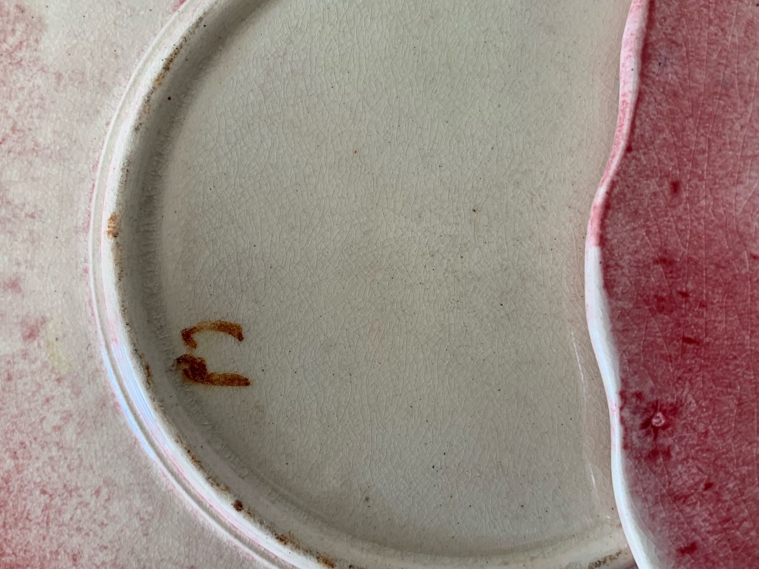 Two plates in slip by ceramist Delphin Massier