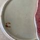 Two plates in slip by ceramist Delphin Massier