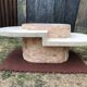 Asymmetrical coffee table from the 80s made of Mactan stone and Magnussen Ponte travertine.