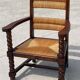 Armchair in stained oak and straw, French work from 1950.