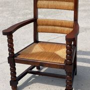 Fauteuil en  chêne teinté et paille, travail français 1950