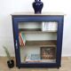 Vintage low glass-fronted library in midnight blue, 1950s.