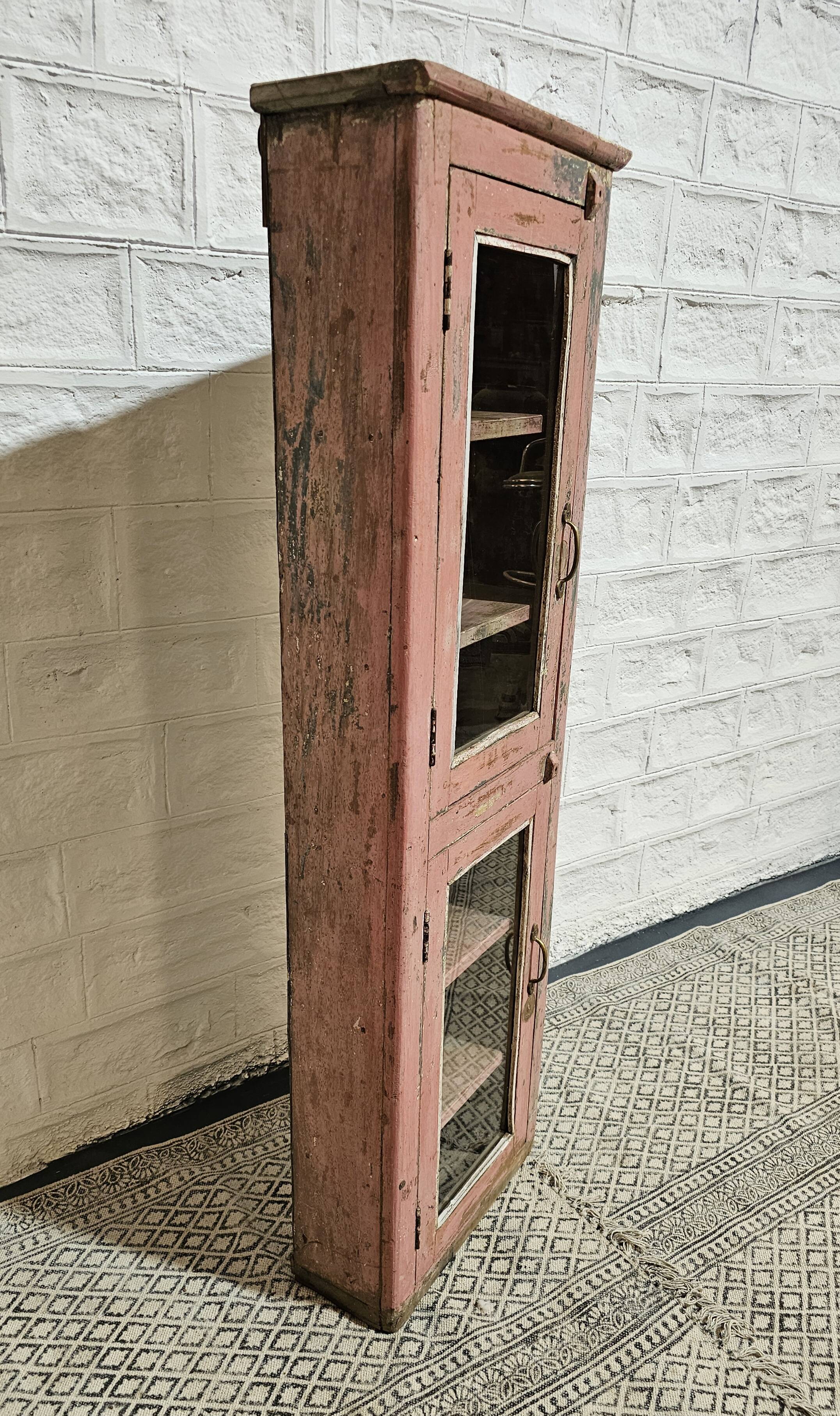 Pink showcase in Burmese teak
