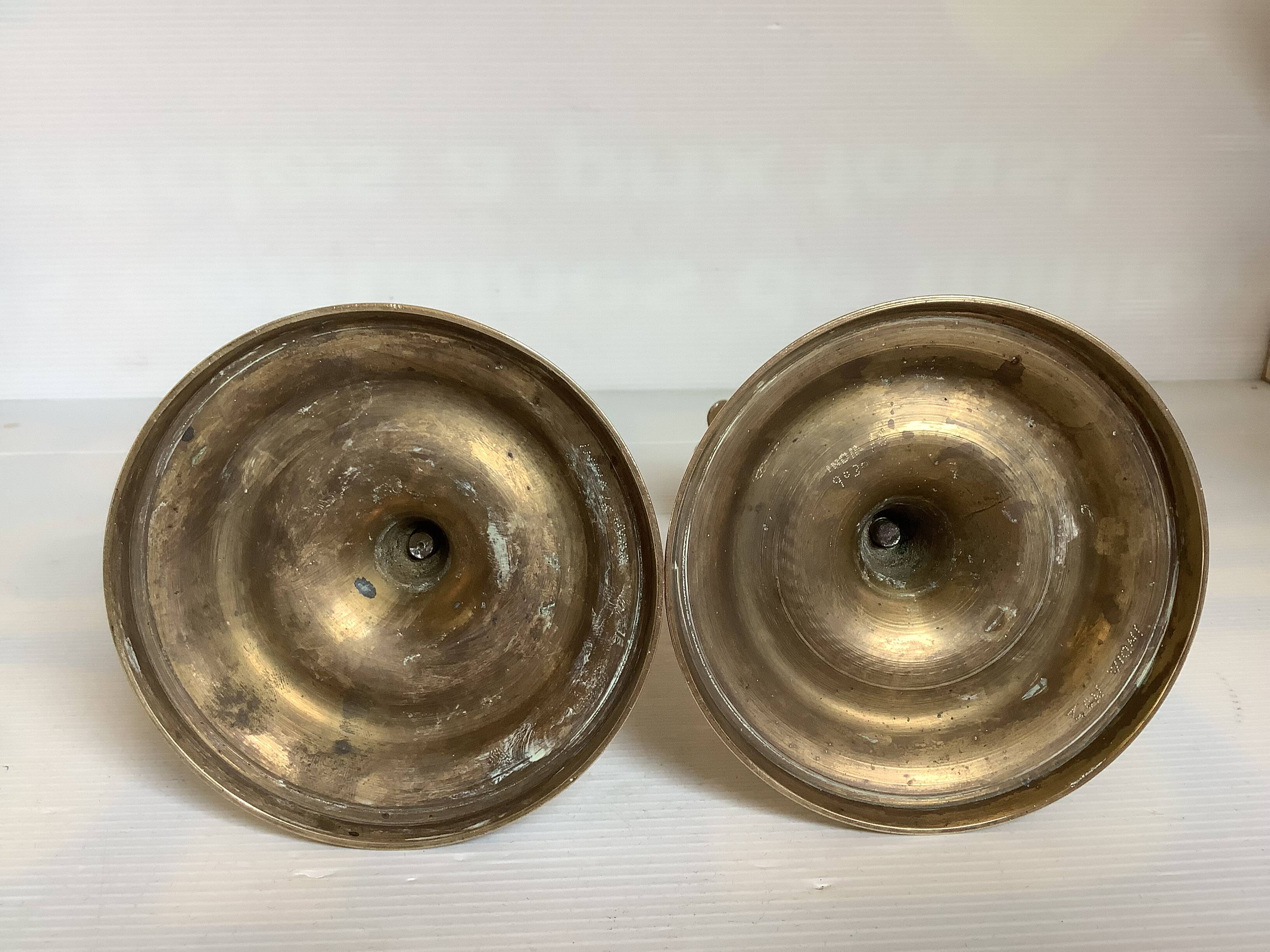 Pair of brass candlesticks with worked flower balls.