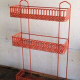 Vintage shelf in red openwork metal